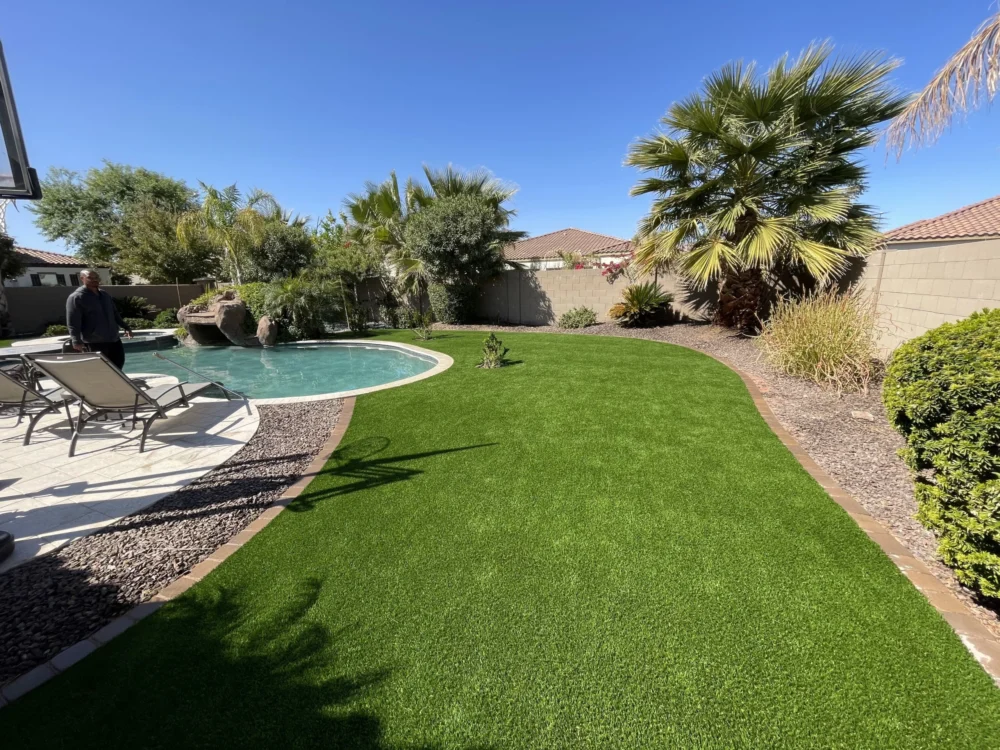 artificial grass lawn around a pool in phoenix arizona. Artificial grass installed by Apex Turf AZ