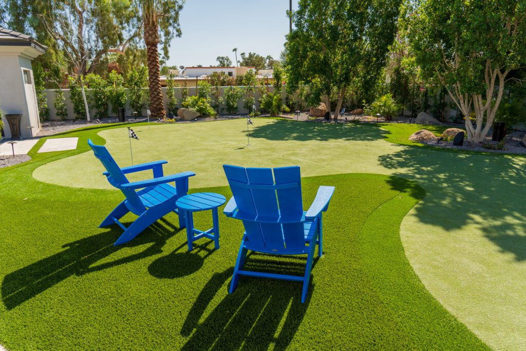 A backyard oasis with a mini synthetic putting green crafted by Apex Turf in Chandler