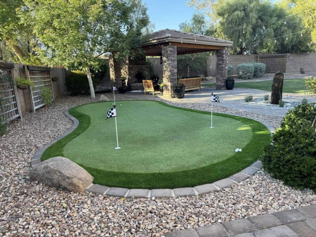 A simple 3 hole backyard putting green surrounded by some basic desert landscaping in Chandler AZ