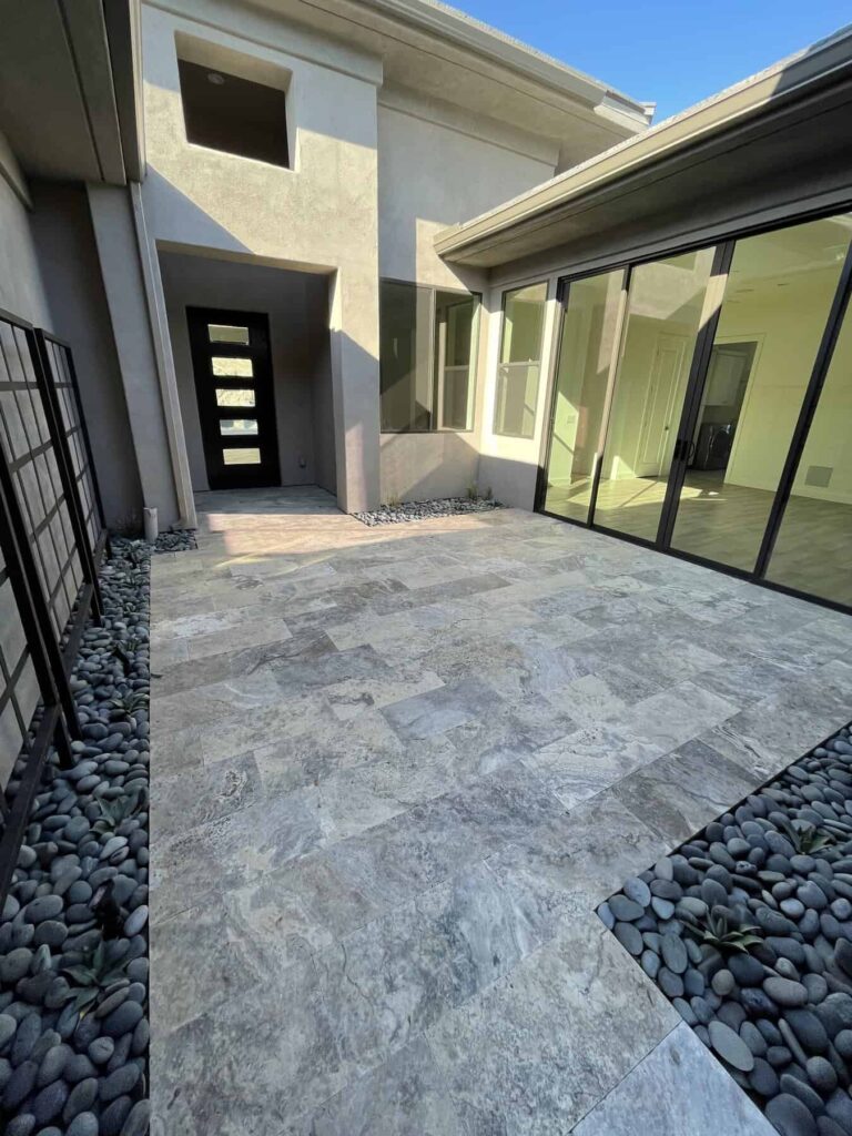Travertine tile in the front entrance and patio. Travertine in the 'silver' color from Monterrey Tile