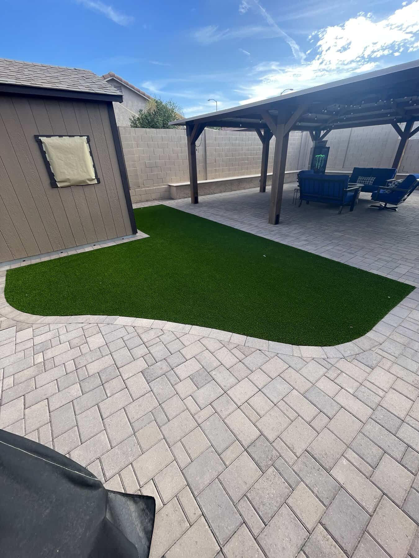 paver border surrouding a freshly installed piece of artificial grass at a house in Paradise Valley Arizona