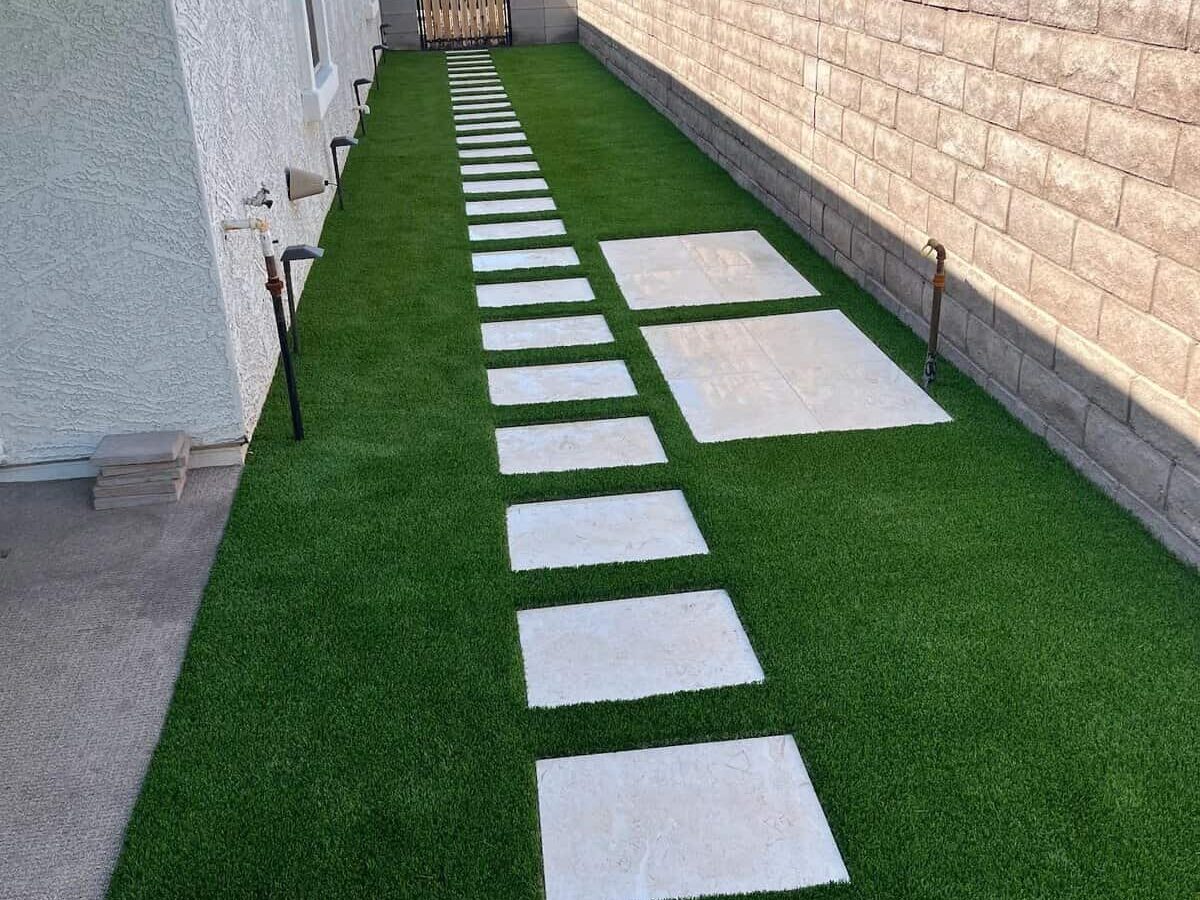 Side yard walkway with turf and pavers, installed at a home in Phoenix AZ