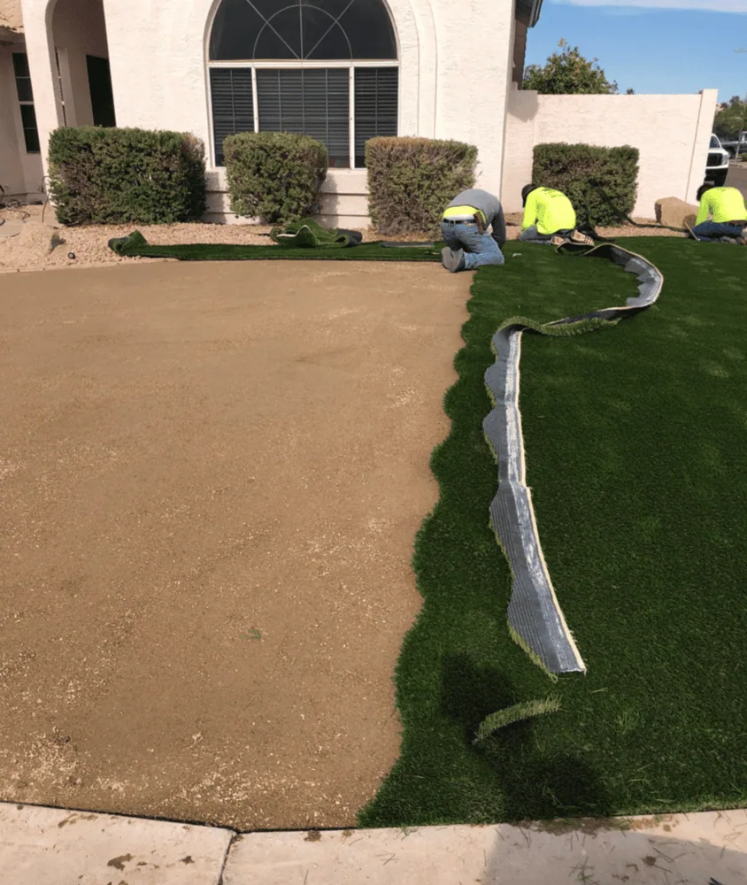 Compacted quarter minus base in a front yard in Arizona. Base installed to stop weeds growing through artificial turf. Artificial grass laid over half the base, about to be joined using the "S Seam" method