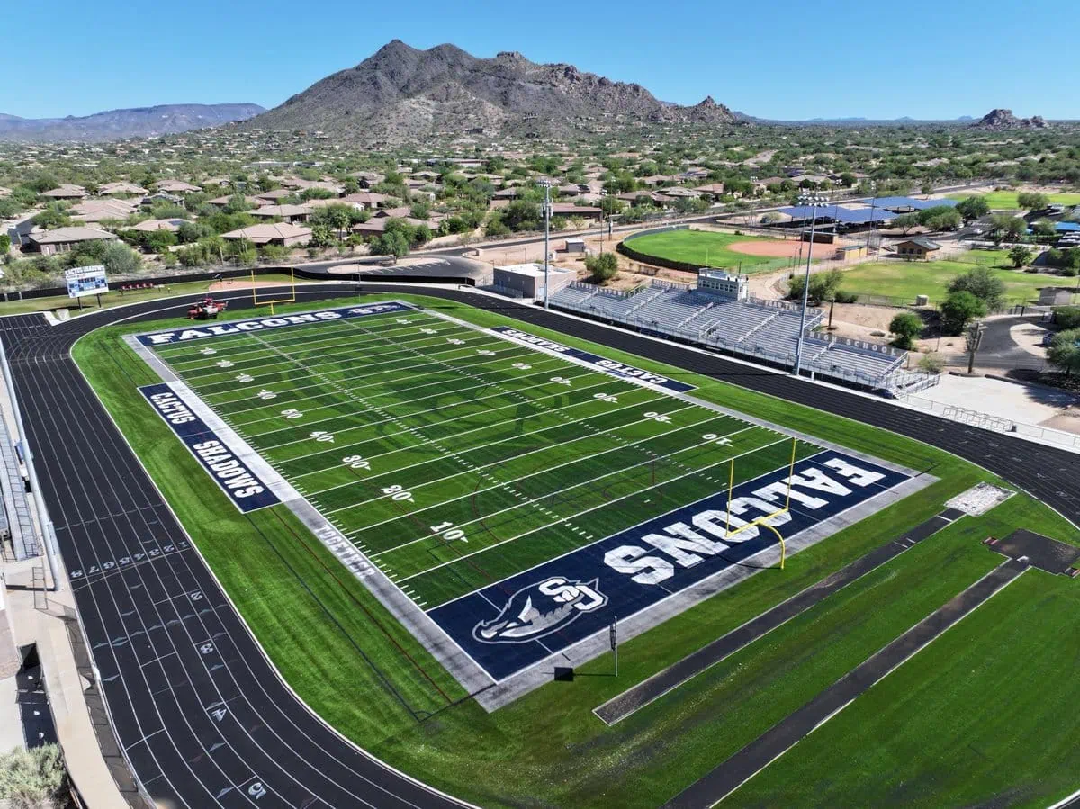 Cactus Shadows Falcons football field in Cave Creek AZ. The astroturf football field was installed by Apex Turf in collaboration with Coyote Sports Turf. The field is installed inside the ring of the athetic track.