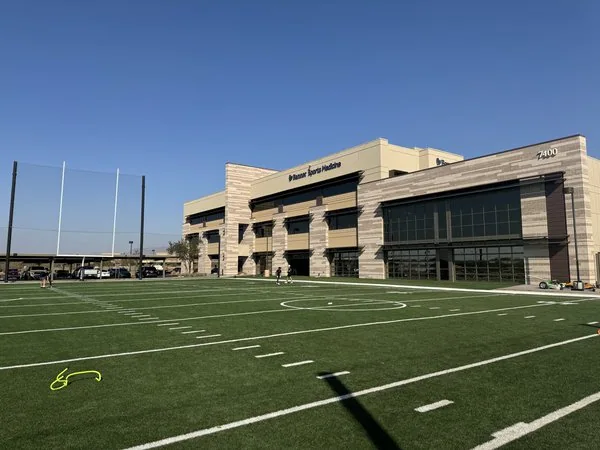 Football training facility with an astro turf football field at a University in Arizona