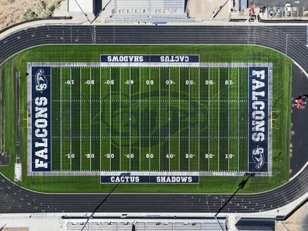 Cactus Shadows highschool in Cave Creek AZ, where Apex Turf and Coyote Sports Turf worked together on this football field. Featuring GameOn sports turf technology.